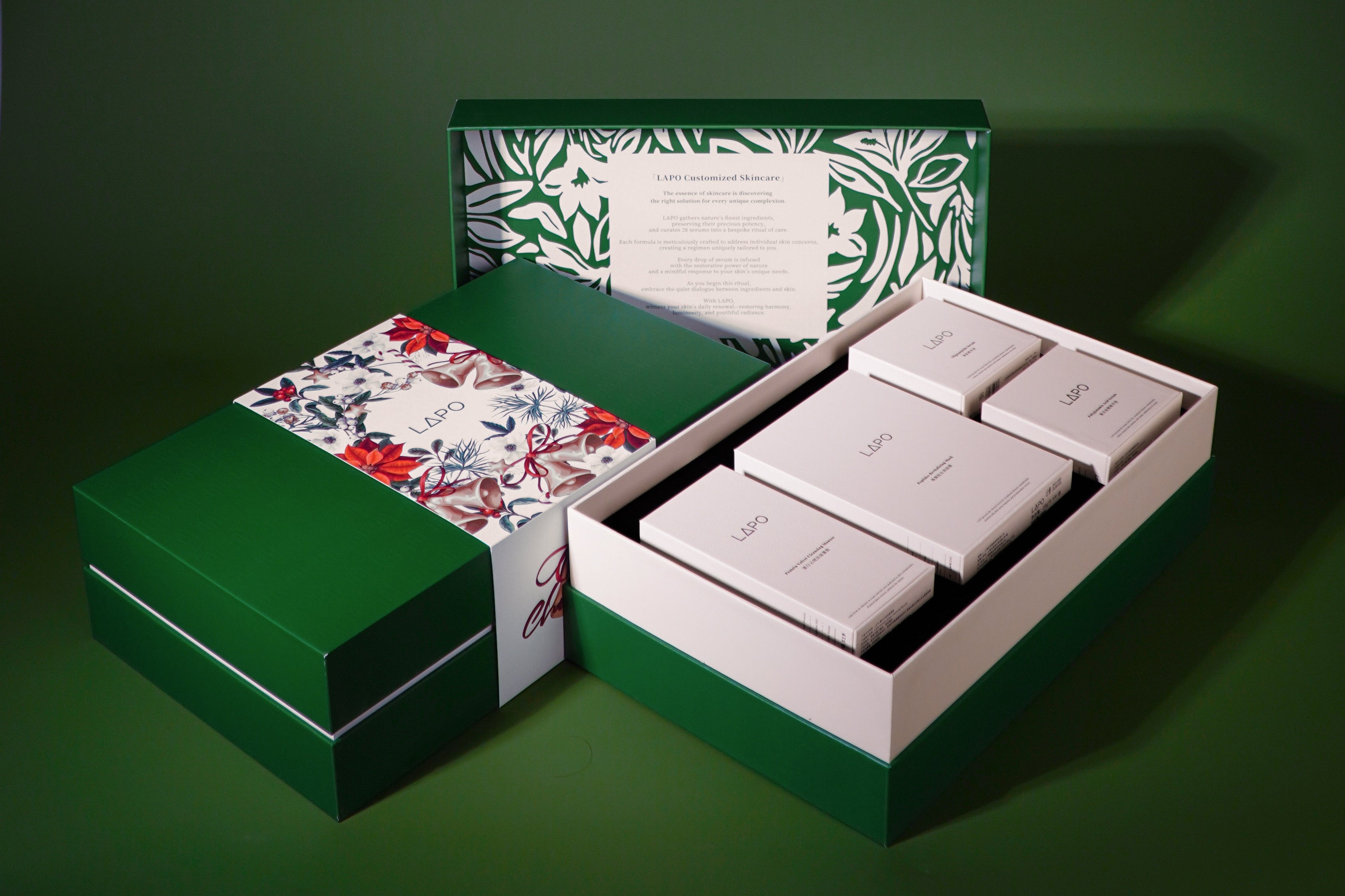Green and white jewelry box with floral design on a dark green background